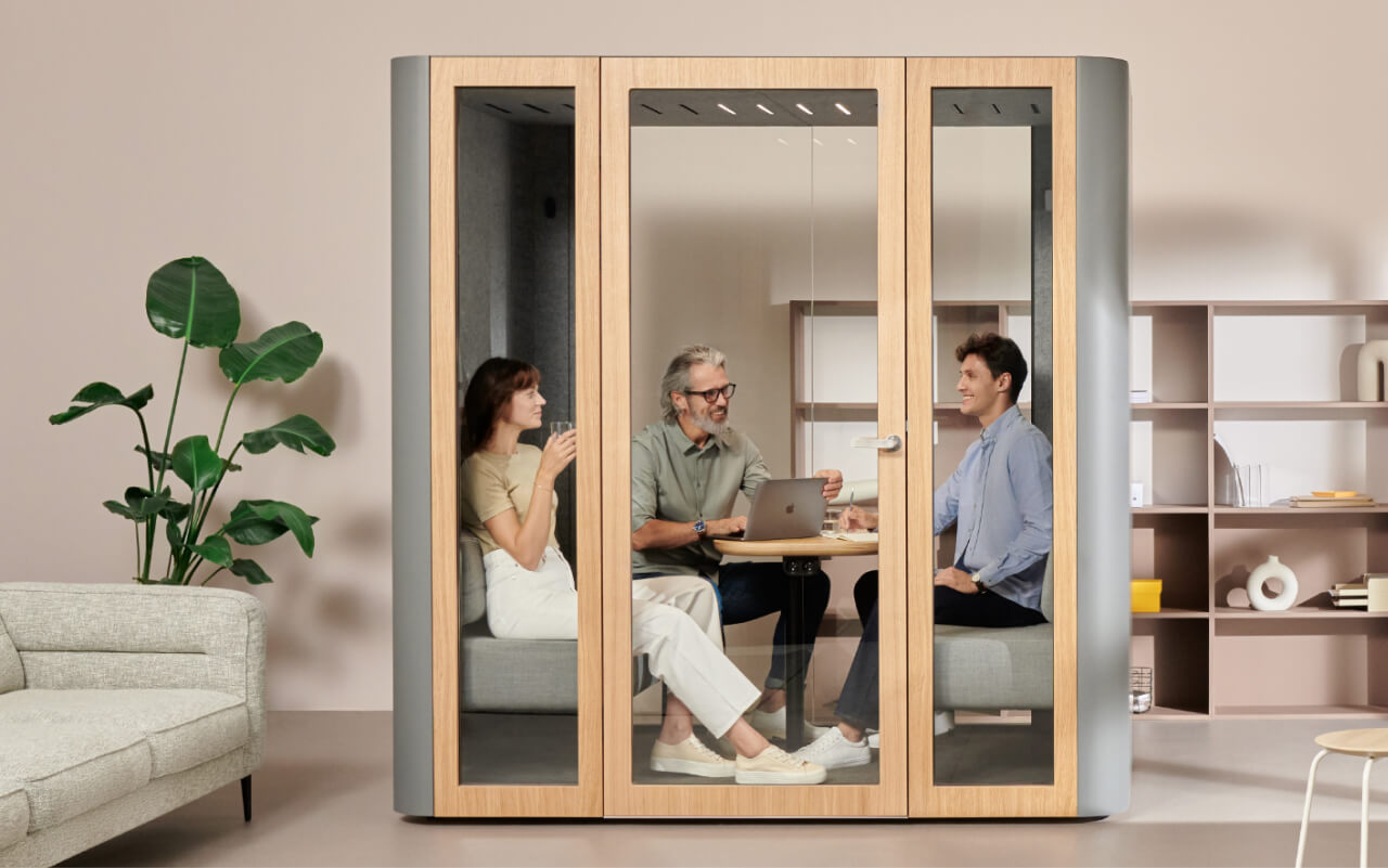 Mute Space L Pod in office interior with people talking inside