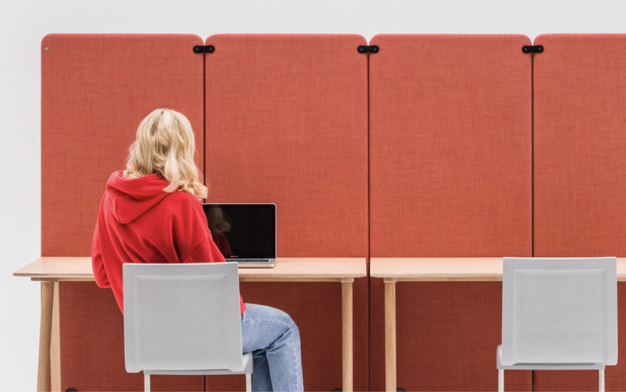 Mute Duo screens in row, attached to desks